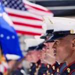 SHOCKING Court Ruling Rocks Military Forever Marines in uniform standing in formation with flags in the background