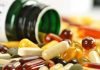 Cancer ‘Shield’ Backfires – Popular Pills Under Fire Assorted vitamins and supplements scattered around an overturned bottle