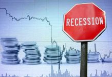Billionaire PREDICTS America’s Final Collapse Recession sign, coin stacks, downward stock chart background.