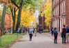 Yale’s Massive Financial Aid Shift: A Blow to Public Universities? People walking on a college campus in autumn.