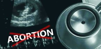 Abortion Pill Protesters Arrested in DC Ultrasound, stethoscope, and ABORTION crossed out in red.