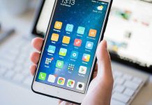 Yearly Screen Time Shocker: Users Confront Reality A person holding a smartphone displaying various mobile applications