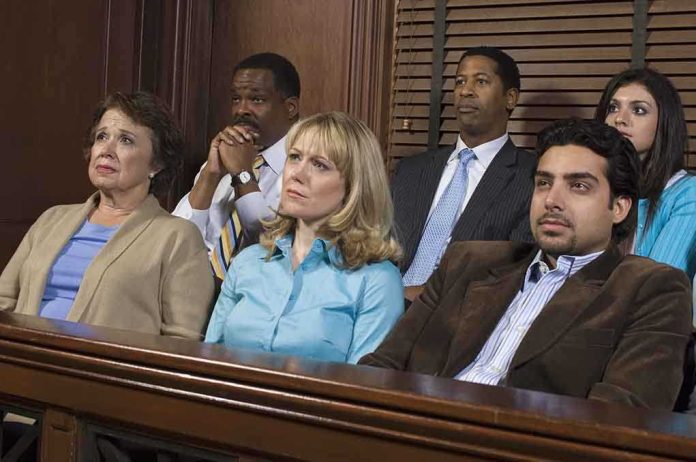 A diverse group of jury members sitting in a courtroom with serious expressions