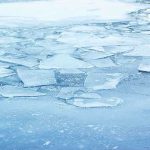 Heartbreaking Loss: 3 Brothers Drown in Icy Tragedy A frozen lake with cracked ice and blue hues