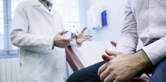 Masculinity Crisis: Men Flooding Plastic Surgery Clinics A doctor in a white coat discussing with a patient sitting on an examination table