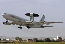 NATO AWACS aircraft taking off from an airfield
