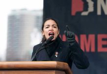 AOC’s Ambitions: Democrats’ 2028 Nightmare? Person speaking passionately at an outdoor podium event