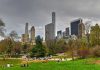 5 A.M. Prayer Shock Hits NYC People relaxing in a park, city skyline background.