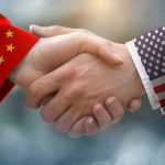 Chinese Spy ORCHESTRATED California Mayor’s Win Chinese and American flag sleeves shaking hands.