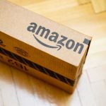 Amazon Drone Crash Sparks Safety Panic Amazon package on wooden floor.