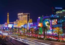 Las Vegas Strip at night with bright neon lights.