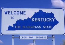Shocking Cancer Crisis Grips Kentucky Heartland Welcome sign for Kentucky, the Bluegrass State, with a blue background