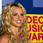 Hollywood DUI Shock: Britney Spears Arrested A smiling woman with blonde hair at a music awards event