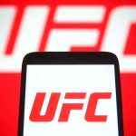 UFC logo on phone screen and background.