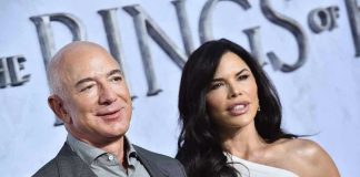 Bezos’ 60-Second Habit Rewires Mornings Two people posing at an event.