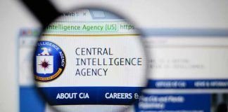 SHOCKING CIA Plan: Machines Running National Security Magnifying glass over Central Intelligence Agency webpage.