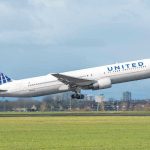 United airplane taking off from a runway.