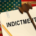 A legal document labeled 'INDICTMENT' with a gavel and pencil