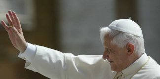 Pope waving to a crowd during a public appearance
