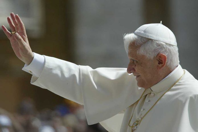 shutterstock_147434921.jpg Pope waving to a crowd during a public appearance