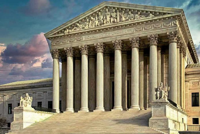 1897301410 Building with columns and statues in front of entrance.