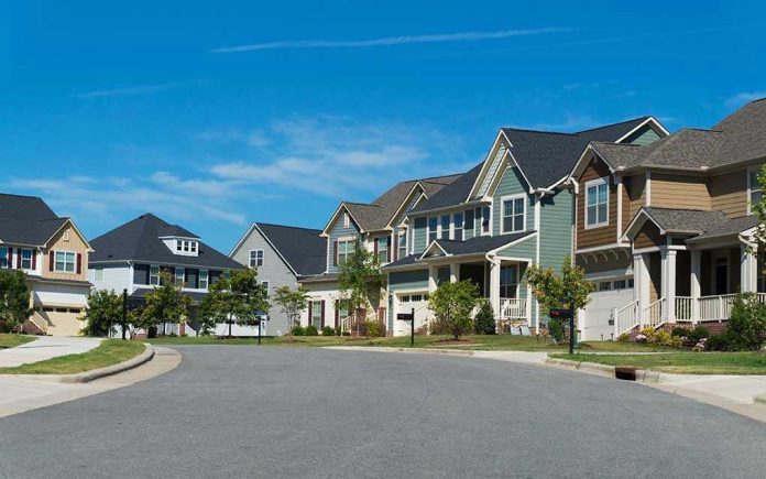 470746946 Suburban street with colorful, modern houses.