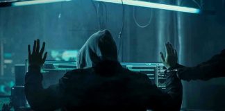 Salesforce CEO’s Shocking AI Surveillance Reveal Hacker in hoodie arrested at computer desk.