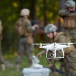 Alleged ISIS Plot: Navy Vet In Crosshairs A military drone being prepared for use with soldiers in the background