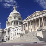 Surveillance Power Teeters — What’s Congress Hiding? The U.S. Capitol building with its dome and columns under a blue sky