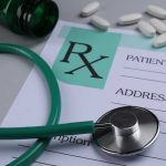 Ozempic Twist: Breast Cancer Risk Plunges? A prescription pad with a stethoscope and pills nearby