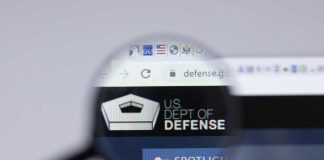 Declassified Biolabs Bombshell Shakes Washington Magnifying glass focusing on US Department of Defense website