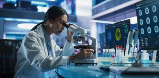 Scientist using a microscope in a modern laboratory