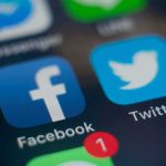 Under-15s Blocked: Platforms Scramble Smartphone screen showing social media app icons