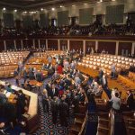Senate Brawl Elevates Controversial Intel Boss Legislative chamber with members gathering on the floor
