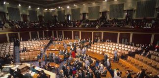 Senate Brawl Elevates Controversial Intel Boss Legislative chamber with members gathering on the floor
