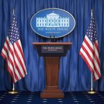 Funeral Turns War Room White House press podium with microphones and two American flags