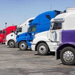 A lineup of colorful trucks parked in a lot
