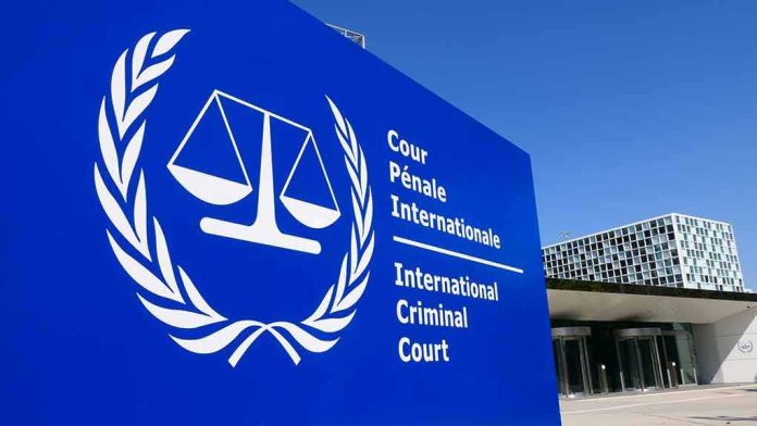 International Criminal Court sign with scales emblem outside modern building