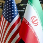 Backroom Iran Deal — Wallets on the Line Flags of the United States and Iran displayed together
