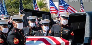 American Deaths, TRUMP Vows Payback U.S. Marines carry a flag-draped casket into a hearse