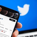Musk’s Megaphone Warps Politics Smartphone displaying a social media profile on Twitter app