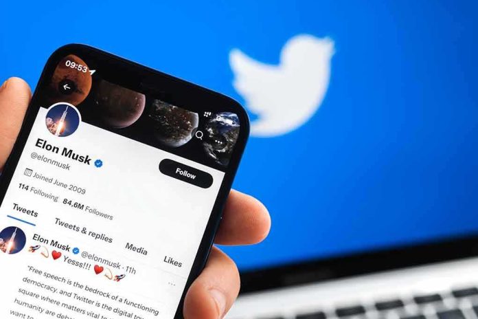 shutterstock_2150043711 Smartphone displaying a social media profile on Twitter app