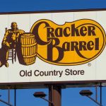Woke Makeover BACKFIRES—Top Boss Falls Cracker Barrel roadside sign with logo against blue sky