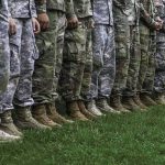 Base Hit in Jordan — Casualties Mount soldiers standing in formation wearing camouflage uniforms and boots