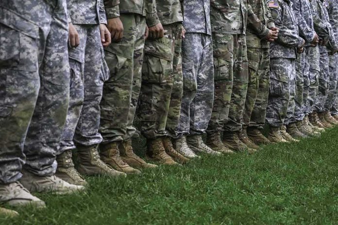 shutterstock_721300162 soldiers standing in formation wearing camouflage uniforms and boots