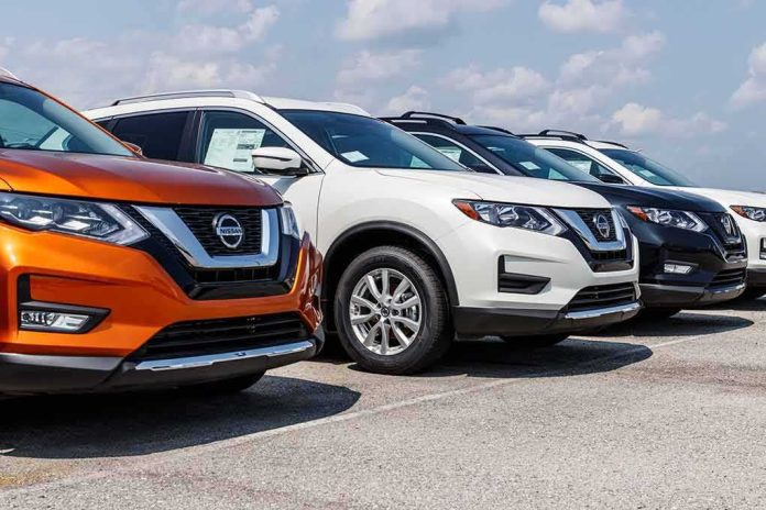 Row of Nissan SUVs parked at a car dealership