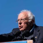 Sanders Torches Democrats: ‘Threat To Democracy’ elderly man speaking at outdoor podium