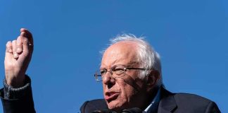 Sanders Torches Democrats: ‘Threat To Democracy’ elderly man speaking at outdoor podium