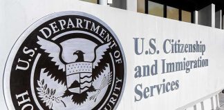 USCIS building exterior sign with DHS seal