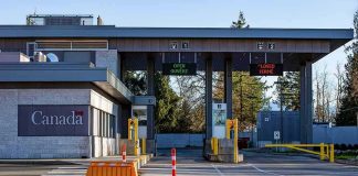 Canada border crossing booths with open and closed lane signs
